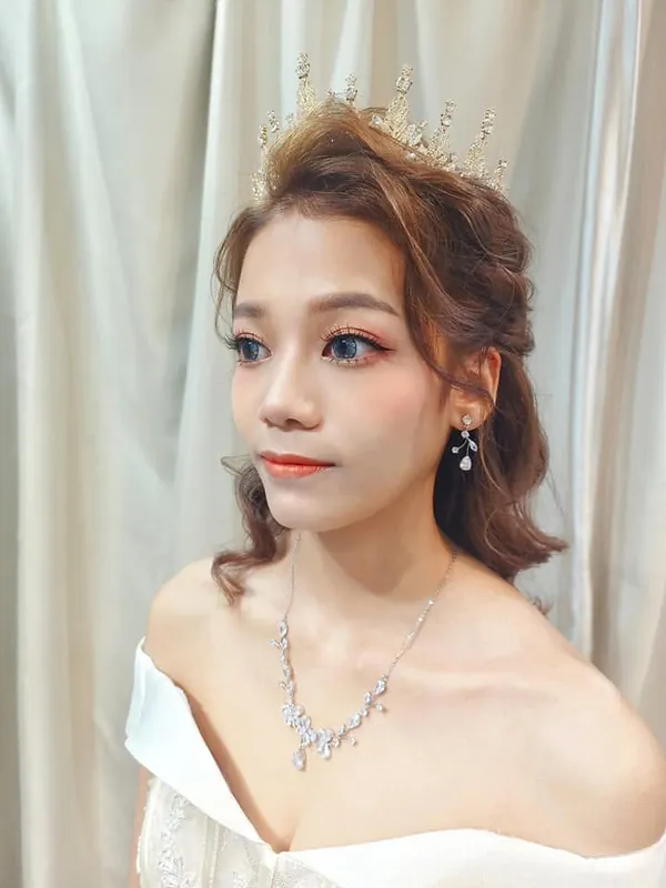 Bridal makeup with crystal crown and soft curls, off-shoulder gown, by THEENG in Kuantan