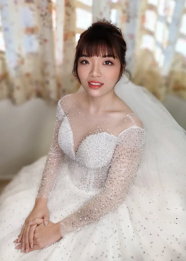 White gown bridal makeup with soft fringe and sparkling long-sleeve gown, by THEENG, Kuantan
