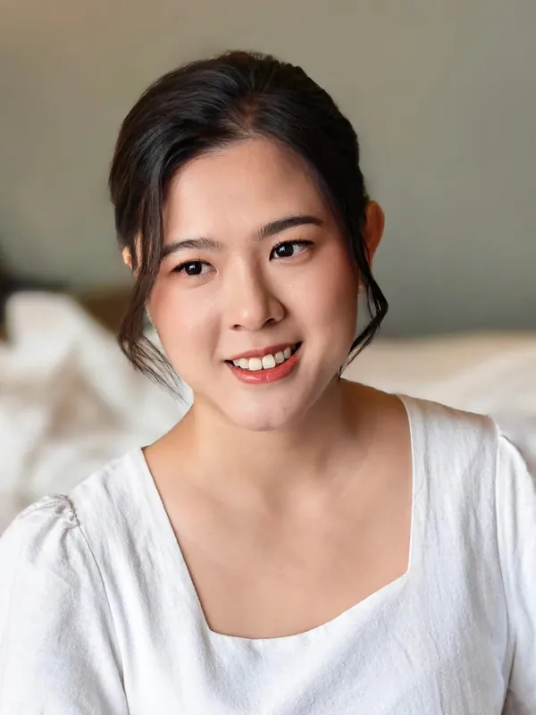 Fresh natural makeup with a soft smile and loose tendrils by THEENG, makeup artist in Kuantan