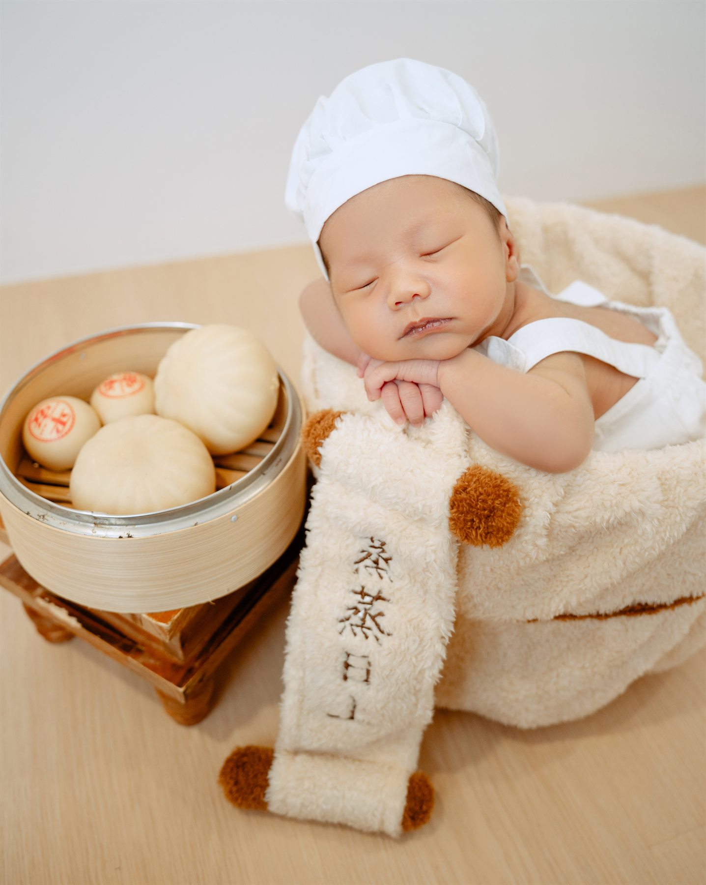 Newborn photography by Famous Bridal for VV Confinement Centre collaboration, baby portrait with traditional buns