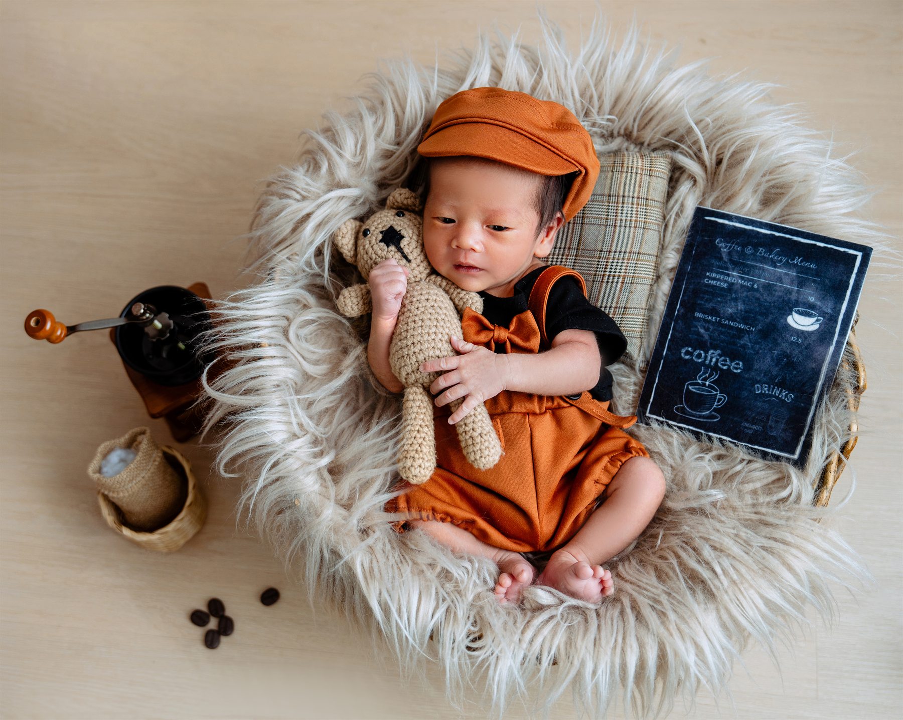 Newborn photography by Famous Bridal, baby cafe theme portrait with teddy bear prop